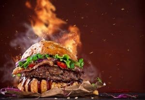 Delicious hamburger with fire flames